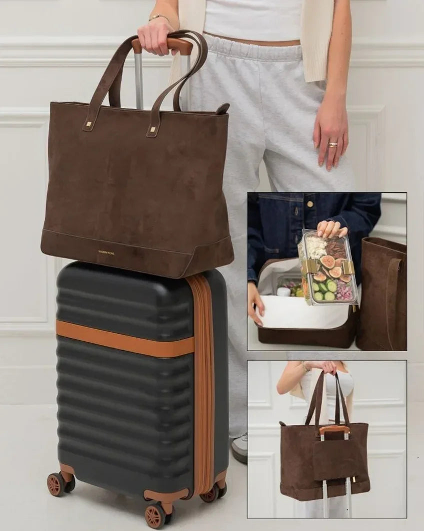 Brown vegan leather tote bag with insulated lunch compartment, shown with suitcase for travel or work