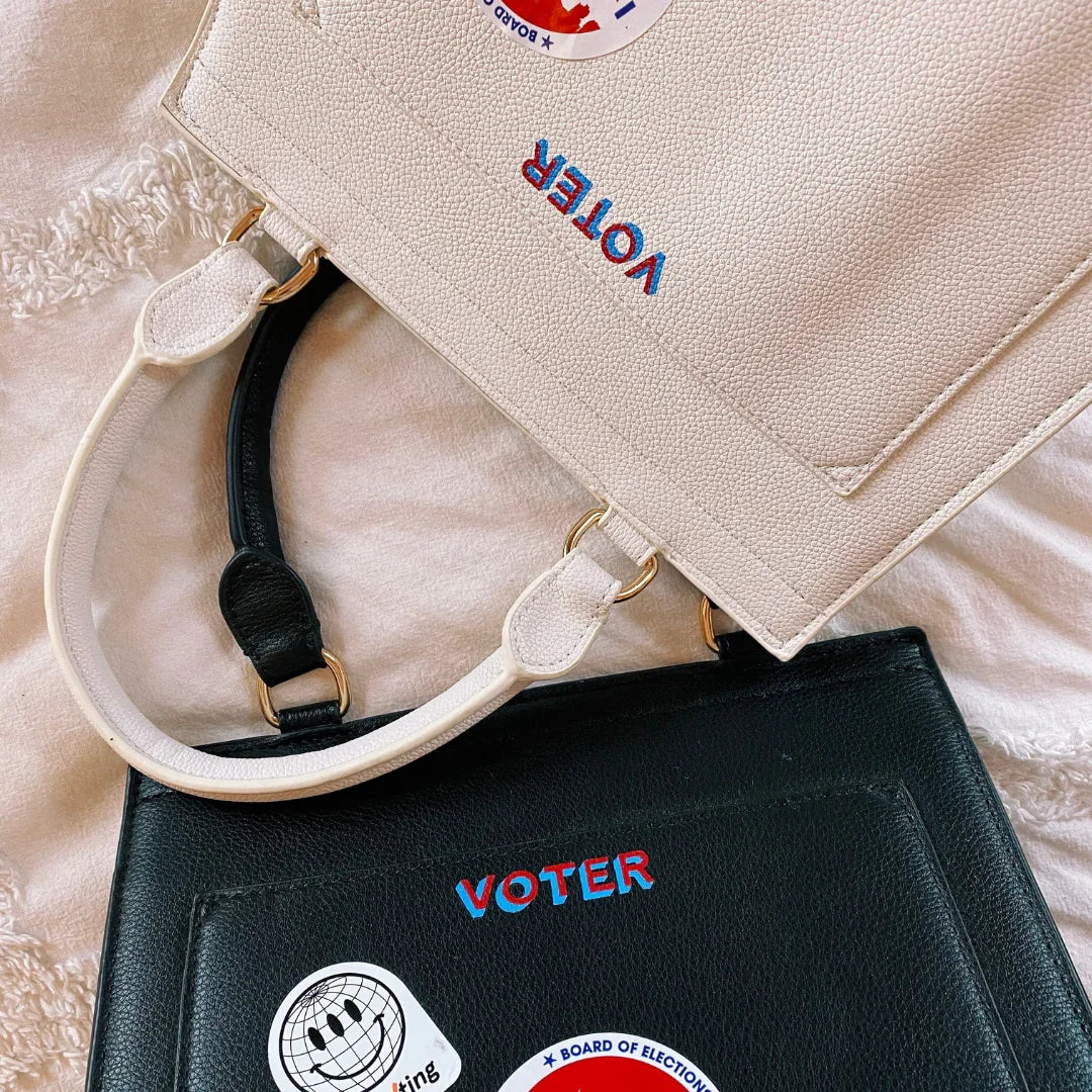 Stylish vegan leather tote bags with 'VOTER' embroidery, perfect for work or everyday use.