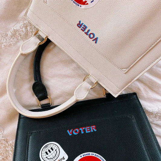 Stylish vegan leather tote bags with 'VOTER' embroidery, perfect for work or everyday use.