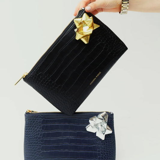 Chic black and navy vegan leather clutch lunch bags with gift bows, gold zippers, crocodile texture