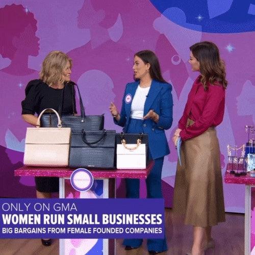 Three women discussing stylish vegan leather totes and lunch bags on GMA, featuring chic insulated designs for work and travel.