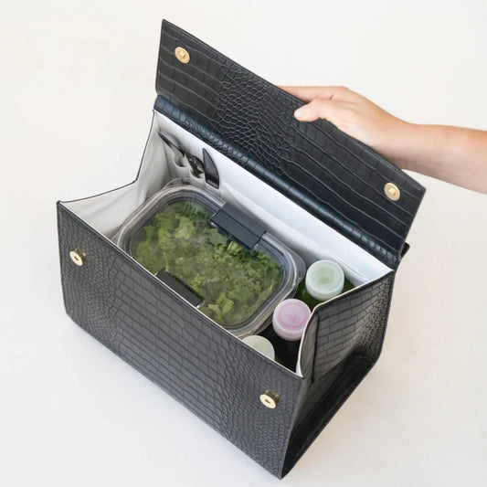 Black textured vegan leather lunch bag with insulated interior holding salad container and drink bottles