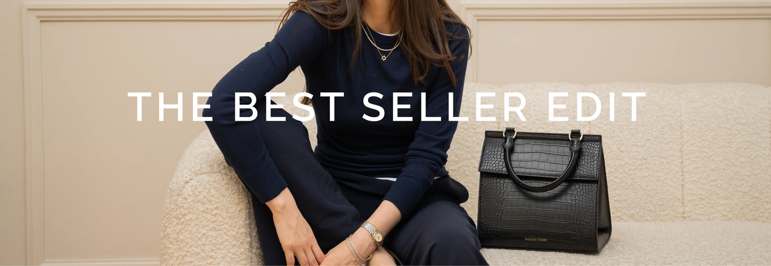Woman in navy outfit with black croc-texture vegan leather tote bag, best seller edit