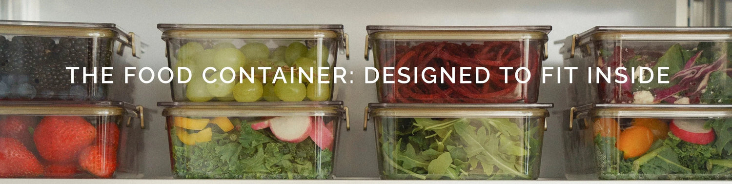 Clear food containers with fresh fruits and salads, designed to fit inside insulated lunch bags