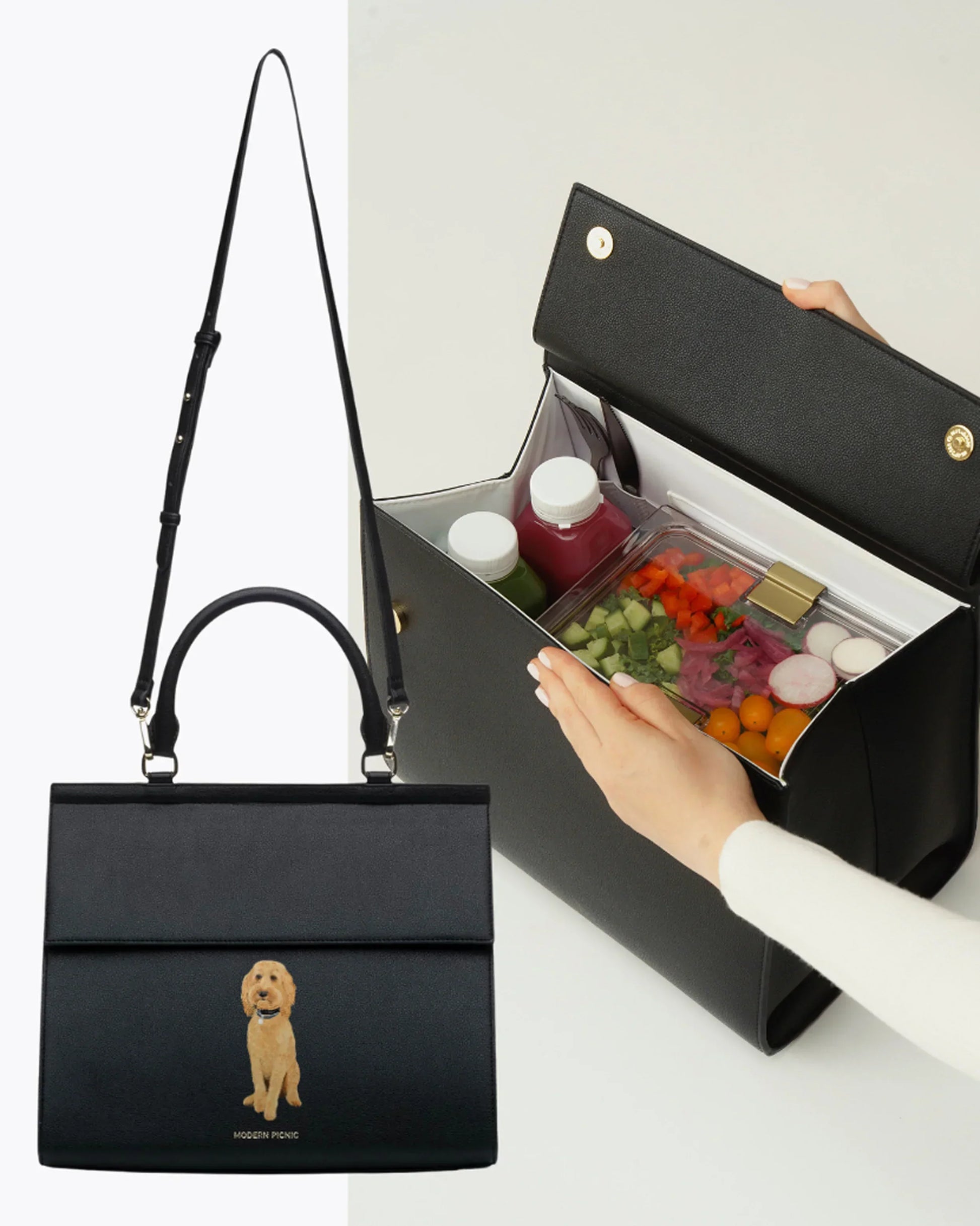 Chic black insulated lunch bag with dog print, open to show organized food containers inside.