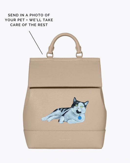 Beige vegan leather lunch bag backpack with custom embroidered cat design on front