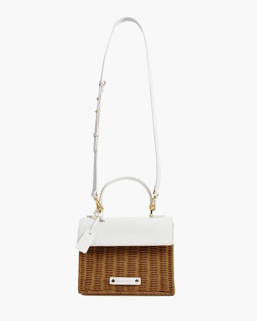 Chic insulated lunch tote with brown woven body, white vegan leather flap, and adjustable strap