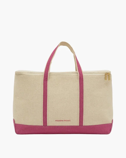 Chic insulated lunch tote with pink handles and base, gold zipper, and canvas body