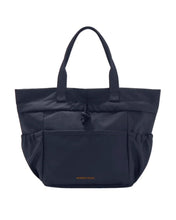 Navy blue insulated tote bag with top handles, front pocket, and side pouches