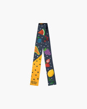 Colorful fruit-patterned silk scarf with polka dots and Modern Picnic text on one end.