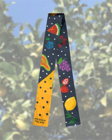 Colorful fruit-print scarf with watermelon, grapes, lemon on navy polka dot background, Modern Picnic brand