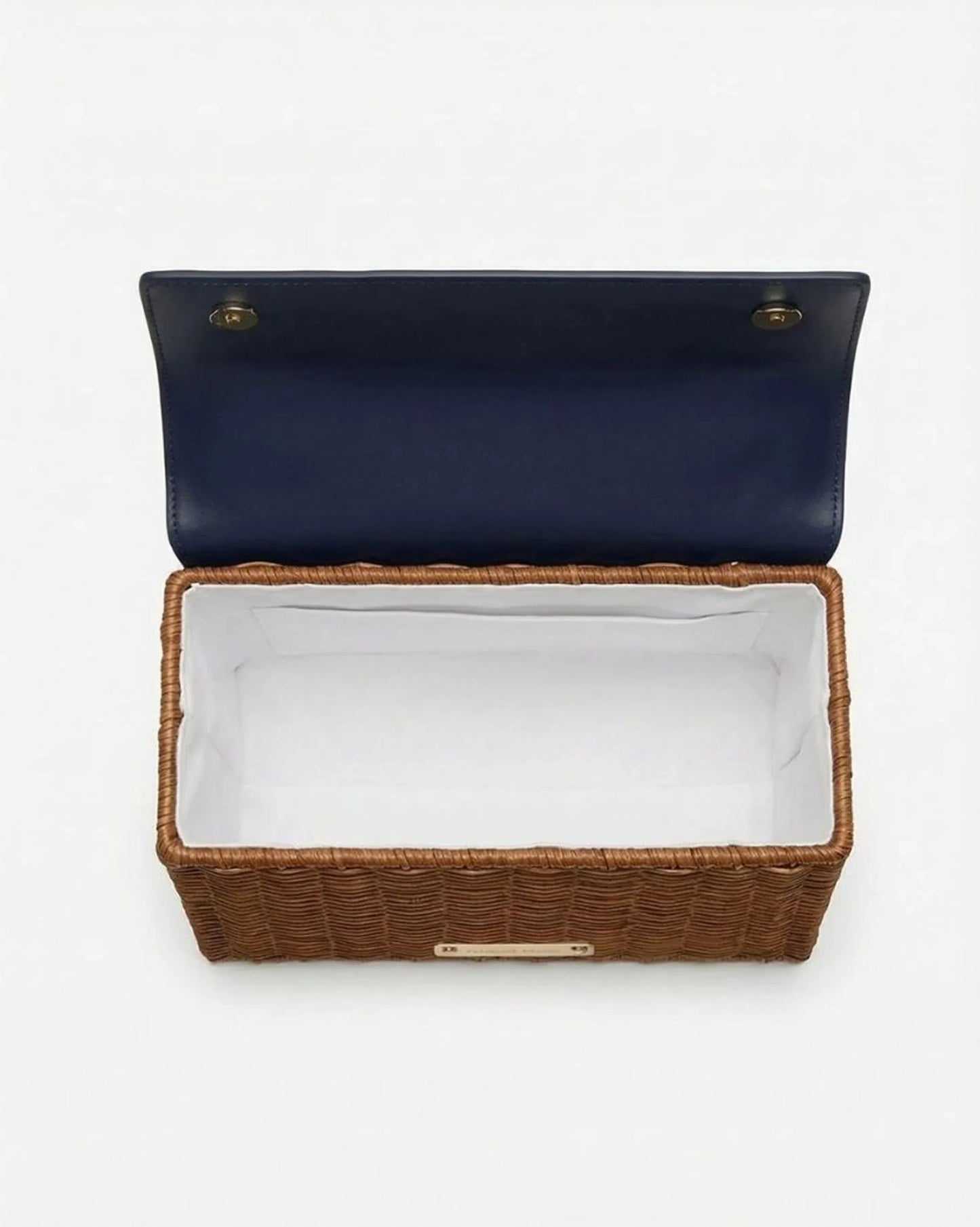 Woven basket-style lunch bag with navy lid and white interior lining, ideal for chic picnics or work meals.