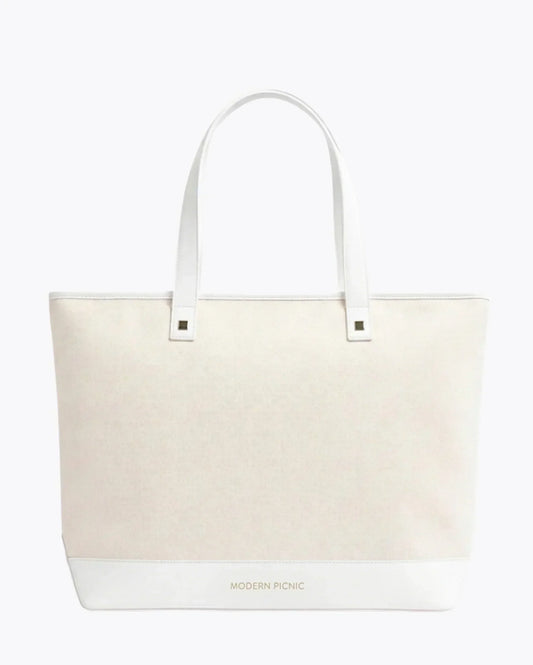 Chic insulated white tote bag with dual handles and minimalist design, modern lunch bag style.