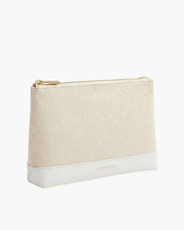 Beige canvas pouch with white vegan leather base and gold zipper, ideal for chic, insulated lunch storage.