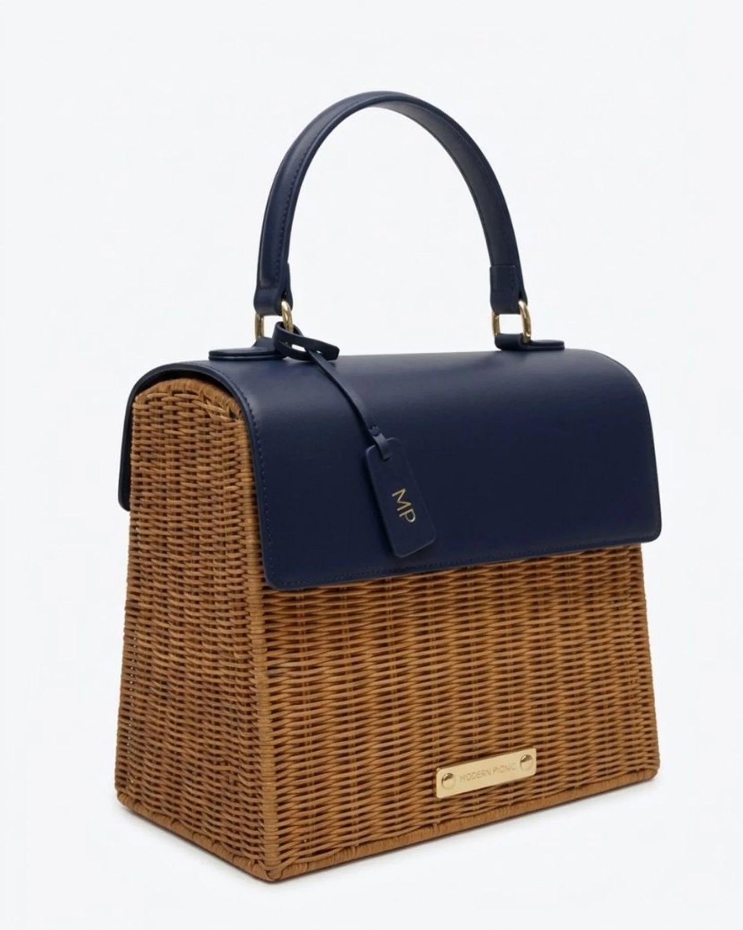 Navy blue vegan leather and woven wicker tote bag with top handle, chic design for work or travel