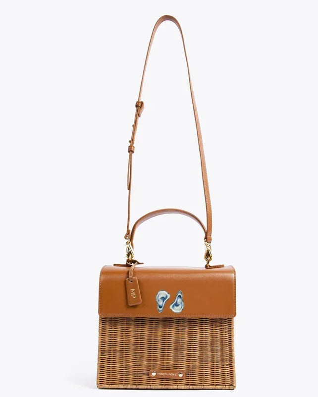 Stylish vegan leather and wicker tote bag with blue flip-flop design, perfect for picnics or everyday use.