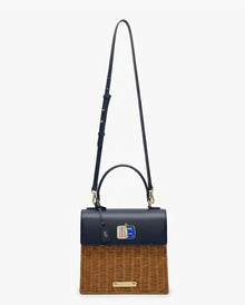 Stylish navy vegan leather and woven tote bag with adjustable strap, perfect for work or travel.