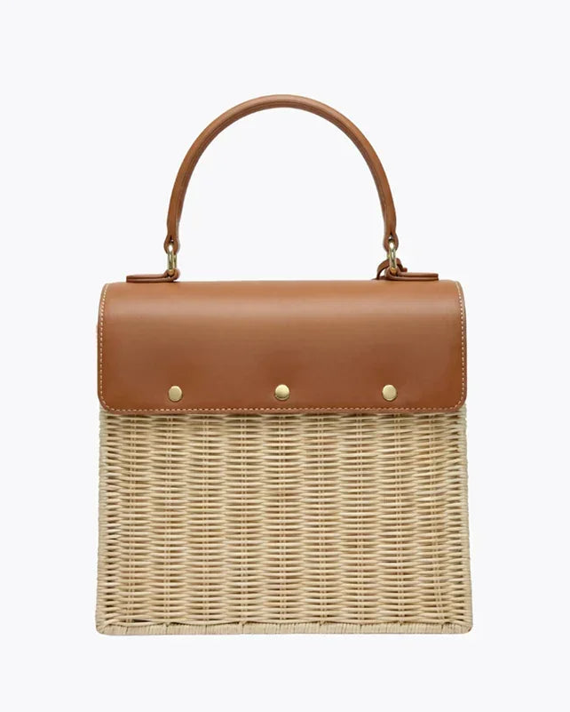 Woven straw tote with tan vegan leather top and handle, chic picnic bag for work or travel