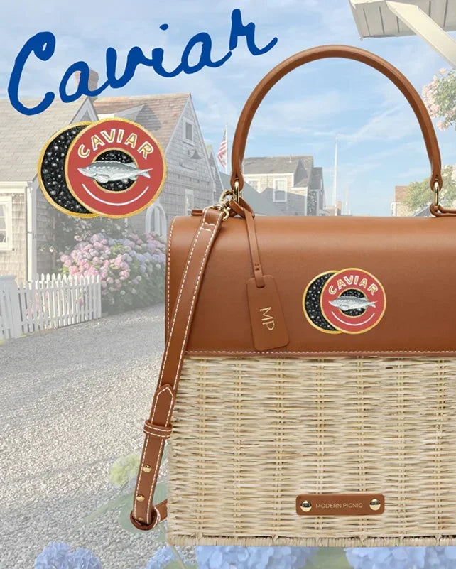 Brown vegan leather and wicker tote with Caviar logo patch, ideal for chic picnics or daily use.
