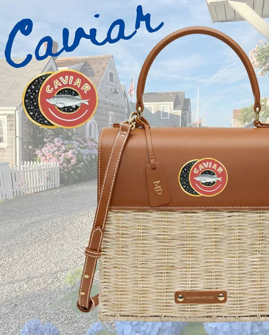 Brown vegan leather and wicker tote with Caviar logo patch, ideal for chic picnics or daily use.