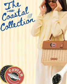 Woman holding woven tote from The Coastal Collection, styled with caviar accents and vegan leather details.