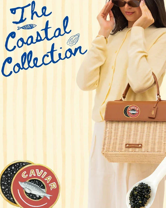 Woman holding woven tote from The Coastal Collection, styled with caviar accents and vegan leather details.