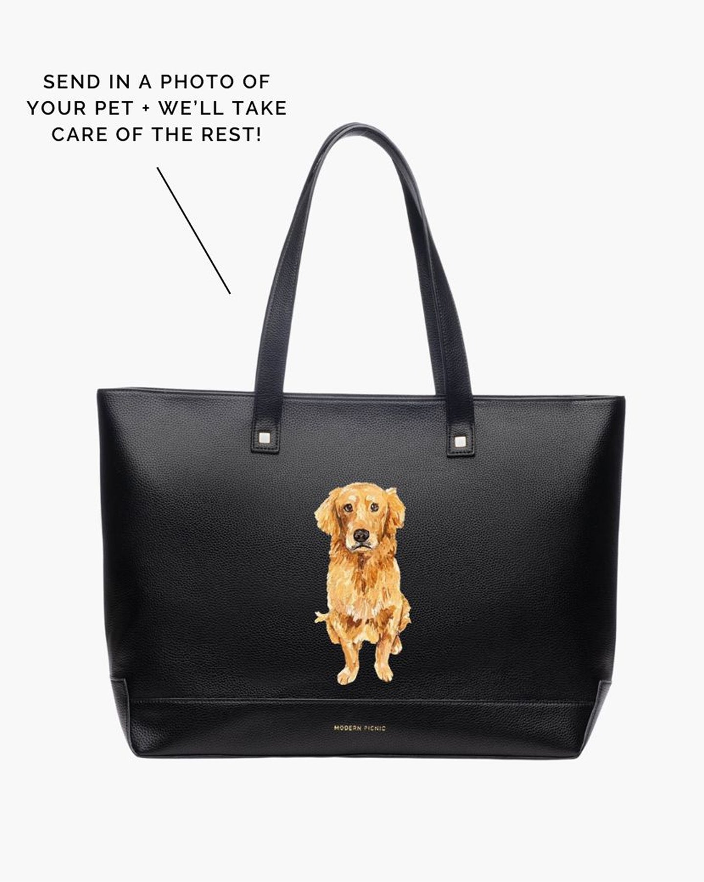 A studio shot of a large black tote bag featuring a custom hand-painted portrait of a Golden Retriever dog sitting on the front. Text overlays explain the custom process: 