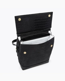 Interior view of the open black vegan leather insulated backpack with white lining and gold magnetic snap closures.