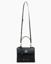 Black Wicker Mini by Modern Picnic shown with long crossbody strap, featuring a hand-woven black wicker exterior, vegan leather flap, gold hardware, and caviar graphic on a white background.