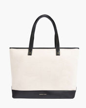 Tote bag with black handle and trim on a white background