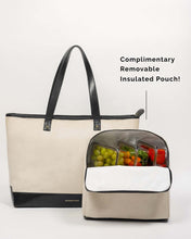 Canvas tote bag with a detachable insulated pouch containing fruits and vegetables on a white background.