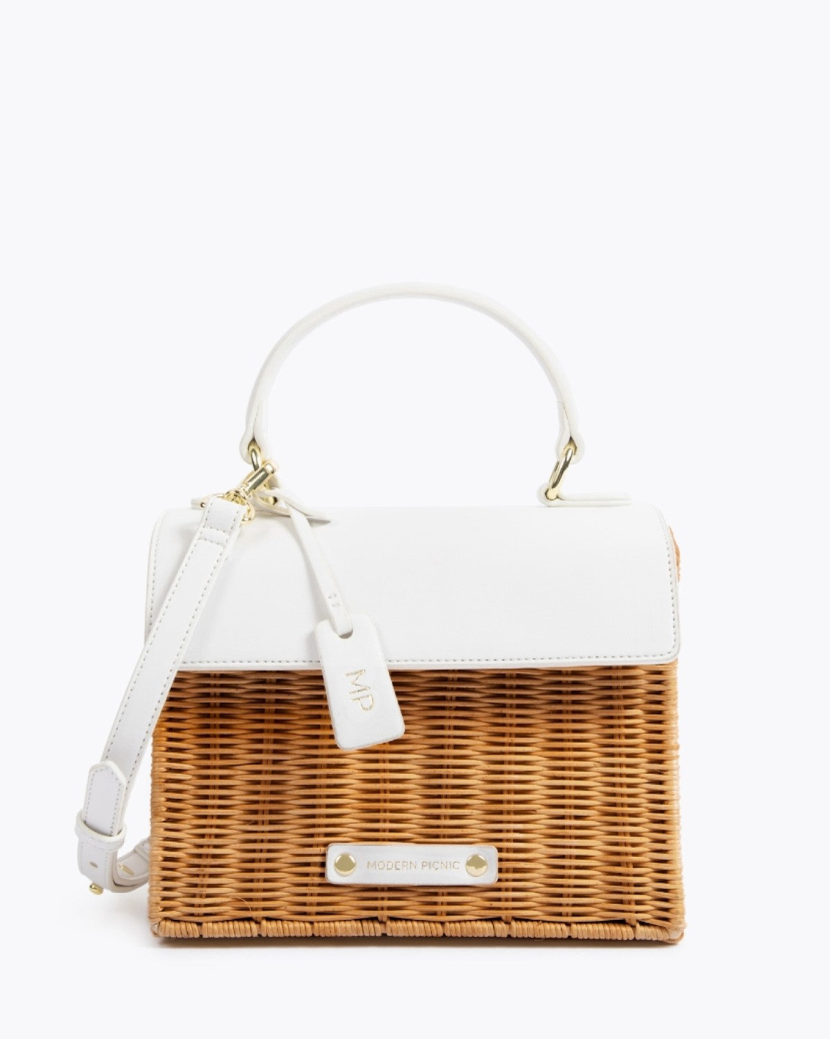 Front view of the Dark White Wicker Mini bag by Modern Picnic featuring a woven dark wicker body, white vegan leather flap, top handle, adjustable strap, and gold hardware – stylish insulated lunch bag.