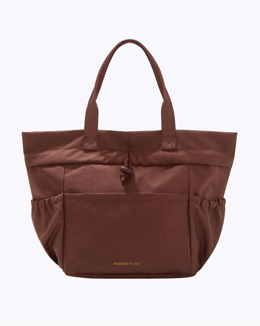 Brown lunchbox with 'Modern Utility' branding on a white background cobranded with FabFitFun