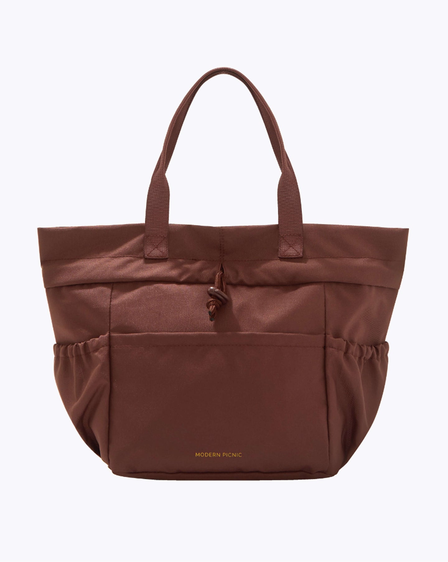 Brown lunchbox with 'Modern Utility' branding on a white background cobranded with FabFitFun