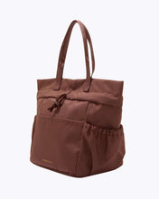 Brown tote bag on a white background cobranded with FabFitFun lunchbox