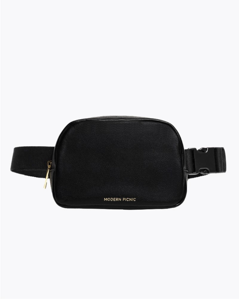 Face on view of a black vegan leather fanny pack with an adjustable strap and gold zip closure.