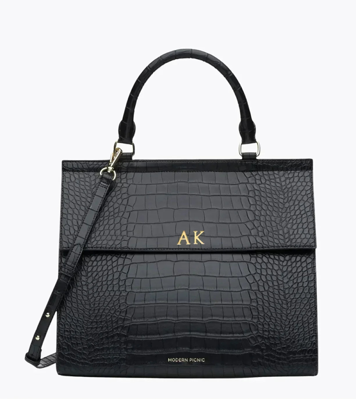 Black vegan leather lunch tote with crocodile texture, monogrammed initials AK, top handle and strap