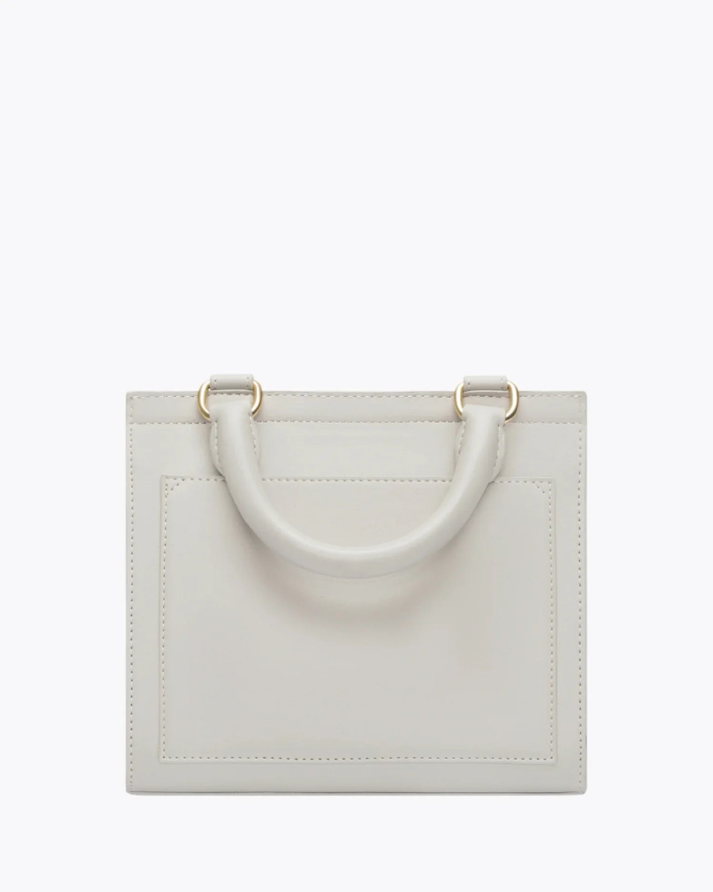 Back view of the Kids Mini Stone bag by Modern Picnic, showcasing the stone-colored vegan leather exterior with a structured rectangular shape, top handle, clean stitching, and gold hardware, displayed on a white background.