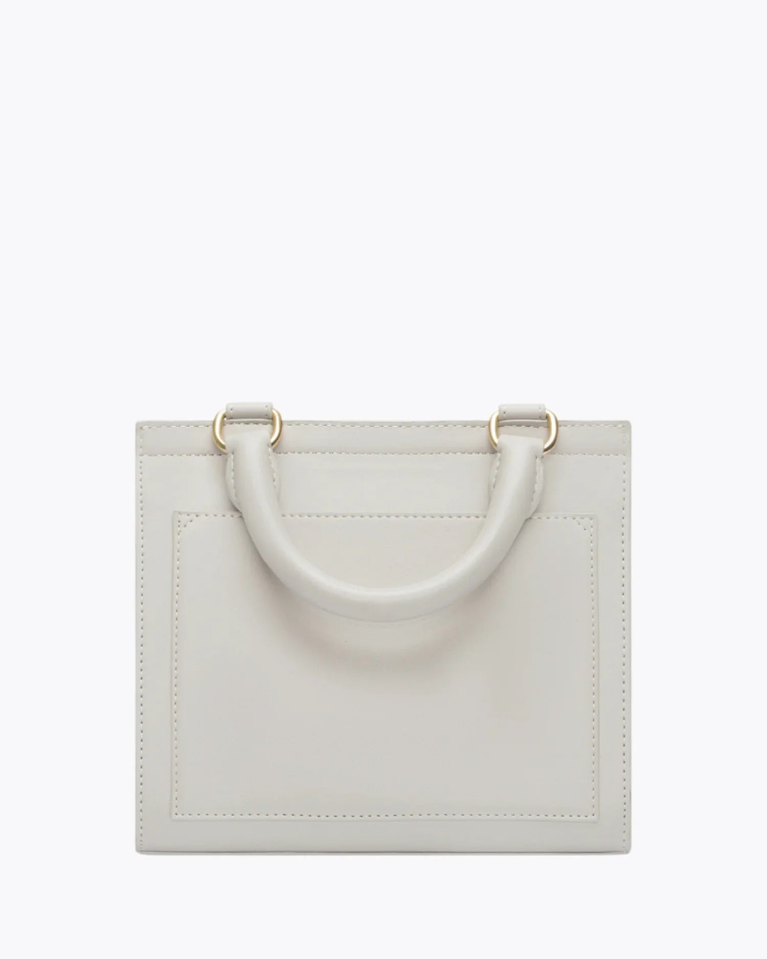Back view of the Kids Mini Stone bag by Modern Picnic, showcasing the stone-colored vegan leather exterior with a structured rectangular shape, top handle, clean stitching, and gold hardware, displayed on a white background.