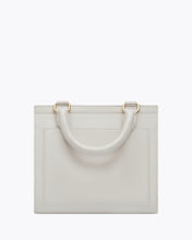 Back view of the Kids Mini Stone bag by Modern Picnic, showcasing the stone-colored vegan leather exterior with a structured rectangular shape, top handle, clean stitching, and gold hardware, displayed on a white background.