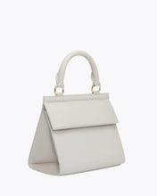 Side angle view of the Kids Mini Stone bag by Modern Picnic, featuring a structured mini silhouette in stone-colored vegan leather with a top handle, gold hardware, and a clean, modern design displayed on a white background.