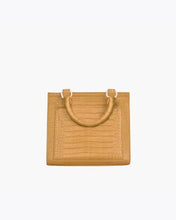 Back view of the Marigold Croc Kids Mini by Modern Picnic, featuring the marigold yellow croc-embossed vegan leather exterior, structured rectangular shape, stitched panel detailing, and dual top handles on a white background.