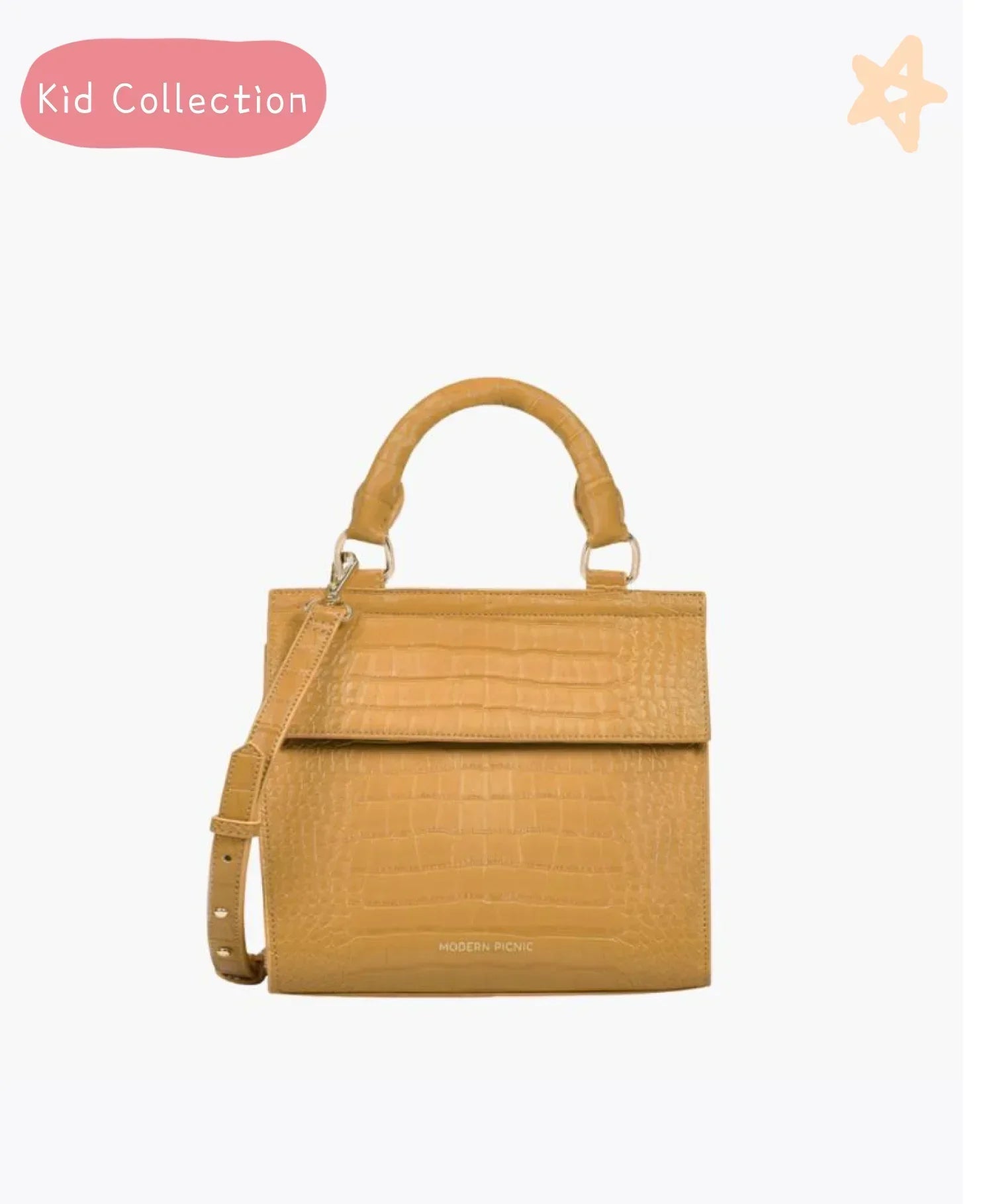 Front view of the Marigold Croc Kids Mini by Modern Picnic, featuring a marigold yellow croc-embossed vegan leather exterior, structured top handle, and adjustable crossbody strap. Displayed on a clean white background with “Kid Collection” text and a star graphic in the corner.