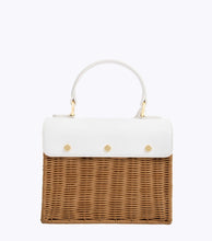 Back view of the Natural Wicker Oyster Mini by Modern Picnic, showcasing the hand-woven natural wicker body, white vegan leather flap with gold snap details, and top handle.