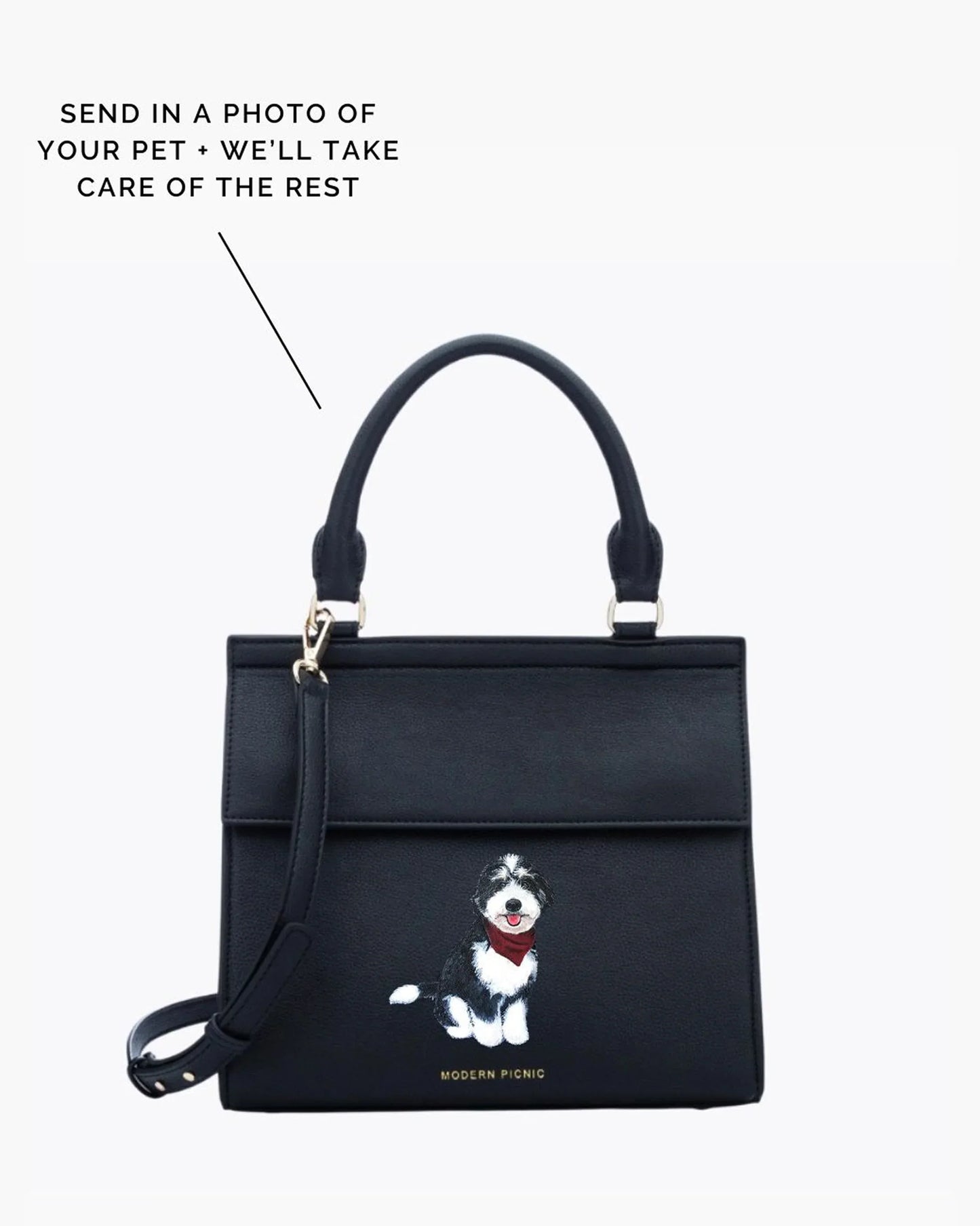 Black insulated lunch bag with custom pet illustration, top handle and crossbody strap.