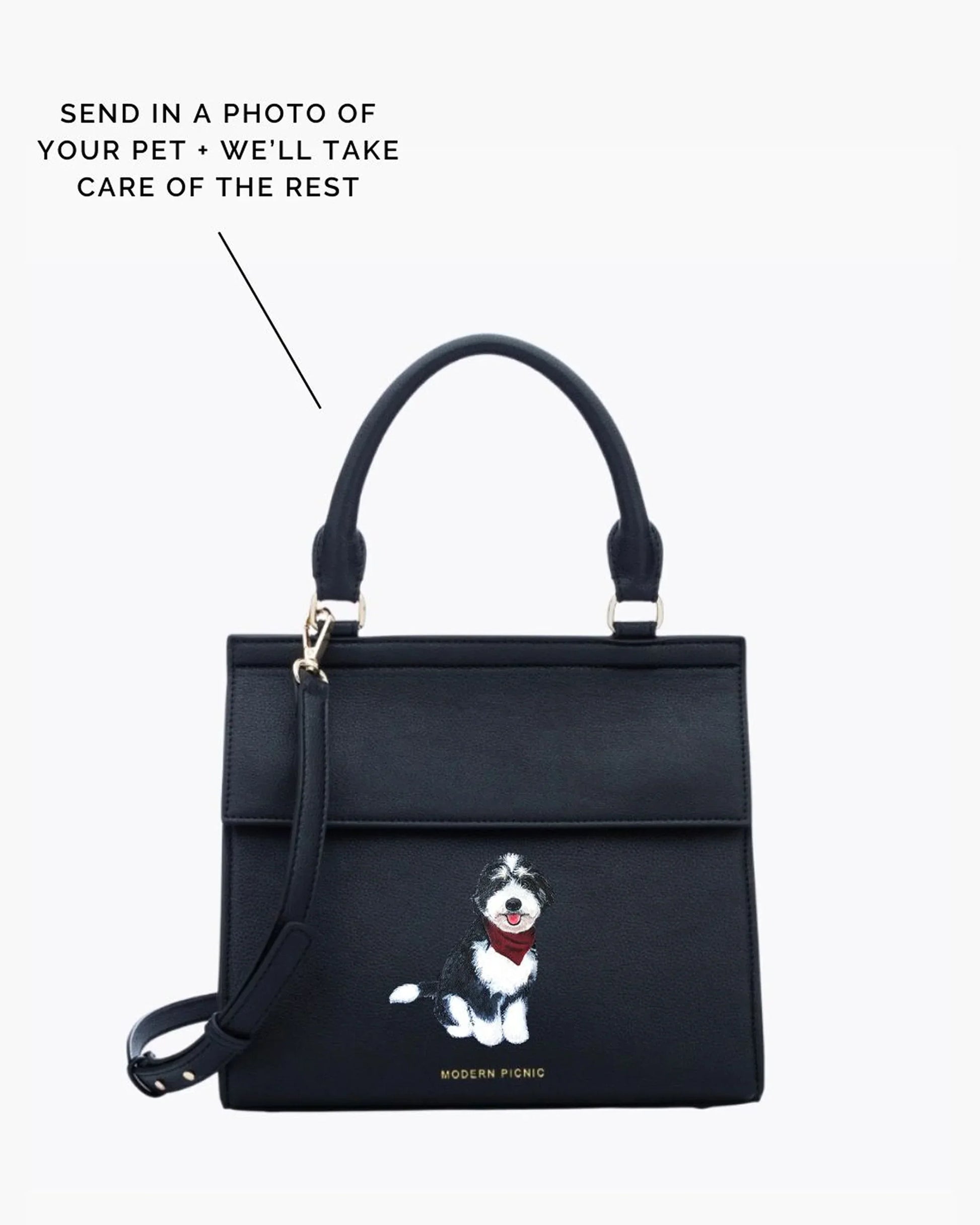 Black insulated lunch bag with custom pet illustration, top handle and crossbody strap.
