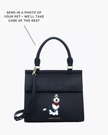 Black insulated lunch bag with custom pet illustration, top handle and crossbody strap.