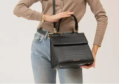 Stylish black vegan leather tote with crocodile texture, perfect for work or travel