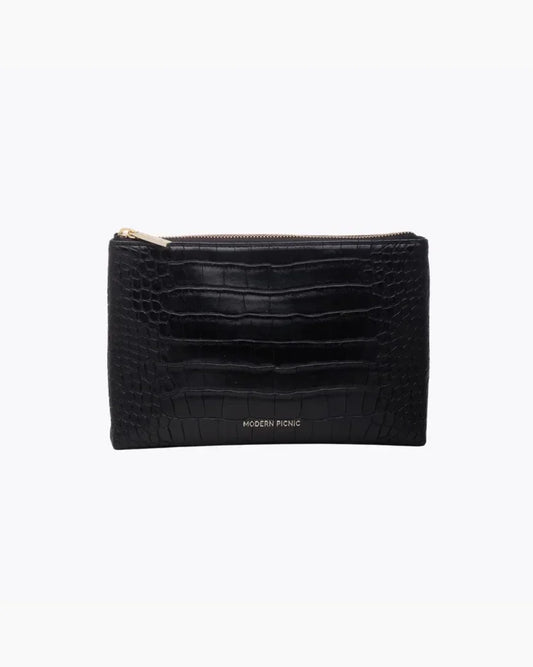 A front-facing studio shot of a small, rectangular black pouch. The bag is made of crocodile-embossed vegan leather and features a gold zipper along the top. The "MODERN PICNIC" logo is subtly stamped in gold near the bottom center.