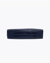 A view of the flat, rectangular base of the small navy blue pouch, showing the crocodile-embossed texture.